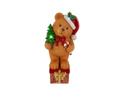 Orsetto di Natale seduto in resina con cappello di Babbo Natale, albero innevato con luci LED multicolor e pacchi regalo