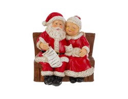 Statuina Babbo e Mamma Natale in resina seduti su panchina, decorazione natalizia