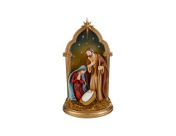 Scultura natalizia in resina con Sacra Famiglia sotto arcata dorata e cielo stellato altezza 46 cm.